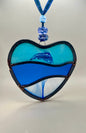 Dancing dolphins glass heart